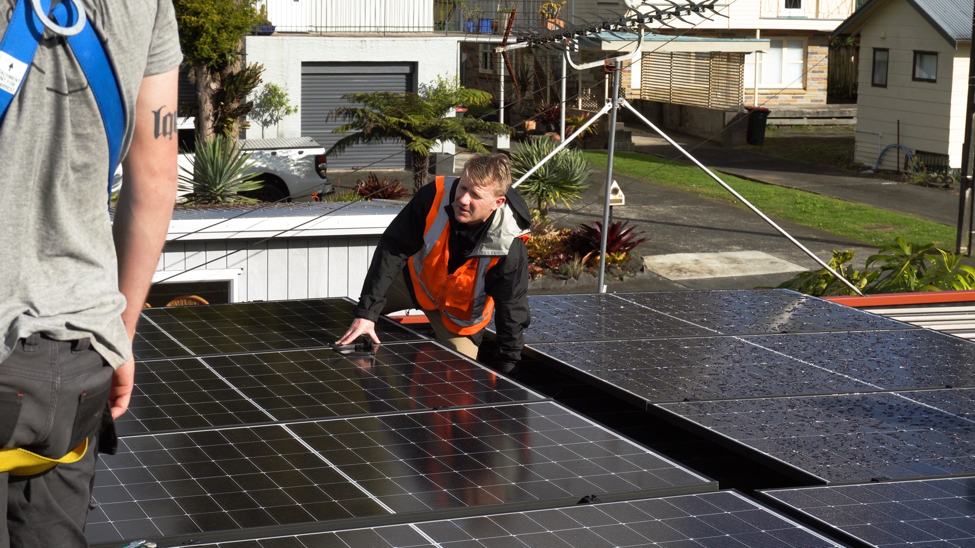 Planet Electrical install team on a rooftop in Auckland